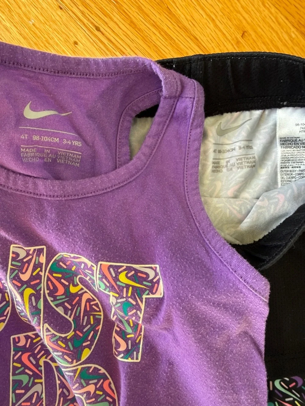 Nike Purple Graphic Tank with Black Shorts and Multicolor Patterned Bike Shorts - Picture 2 of 7